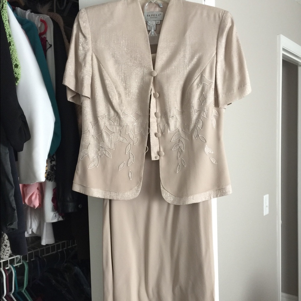 beige women's suit with skirt.